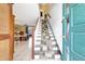 A welcoming entryway leads into a home with a staircase and views of the living and dining areas at 2811 S Pines Dr # 15, Largo, FL 33771