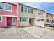 Charming townhouse exterior showcasing curb appeal with bright colors and well-kept grounds at 2811 S Pines Dr # 15, Largo, FL 33771