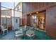 Outdoor patio featuring a glass table and comfortable chairs, perfect for dining at 2811 S Pines Dr # 15, Largo, FL 33771