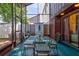A charming screened patio featuring a glass table and seating creates a relaxing outdoor dining area at 2811 S Pines Dr # 15, Largo, FL 33771