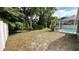 Private backyard with pool view, offering a tranquil outdoor setting at 28818 Midnight Star Loop, Wesley Chapel, FL 33543