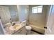 Clean bathroom with tub, vanity, and mirror at 28818 Midnight Star Loop, Wesley Chapel, FL 33543