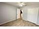 Cozy bedroom features tile floors and closet space at 28818 Midnight Star Loop, Wesley Chapel, FL 33543