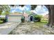 Charming single-Gathering home with an attached two-car garage and mature landscaping at 28818 Midnight Star Loop, Wesley Chapel, FL 33543