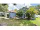 Charming single-story home with a well-maintained lawn and a two-car garage at 28818 Midnight Star Loop, Wesley Chapel, FL 33543