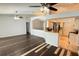 Open concept kitchen and living area, featuring stainless appliances, bar, and modern design at 28818 Midnight Star Loop, Wesley Chapel, FL 33543
