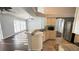 Kitchen boasts stainless appliances, granite counters, and seamless integration with the living area at 28818 Midnight Star Loop, Wesley Chapel, FL 33543