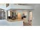 Bright, open kitchen with stainless steel appliances, bar seating, and tile flooring at 28818 Midnight Star Loop, Wesley Chapel, FL 33543