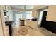 Well-lit kitchen features stainless steel appliances, ample cabinet space, and tile flooring at 28818 Midnight Star Loop, Wesley Chapel, FL 33543