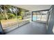 View from the screened lanai to a pool area and fenced yard at 28818 Midnight Star Loop, Wesley Chapel, FL 33543