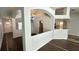 Spacious living room featuring tile floors, neutral paint, and elegant archways with ceiling decor at 28818 Midnight Star Loop, Wesley Chapel, FL 33543