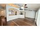 Spacious open-concept living room featuring tile floors and archways to the kitchen at 28818 Midnight Star Loop, Wesley Chapel, FL 33543