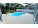 Private in-ground pool surrounded by a screened enclosure, offering a peaceful outdoor space at 28818 Midnight Star Loop, Wesley Chapel, FL 33543