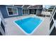 A refreshing screened-in pool with ladders, set in a backyard oasis at 28818 Midnight Star Loop, Wesley Chapel, FL 33543
