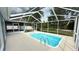 Inviting screened-in pool perfect for relaxation and entertaining with easy access at 28818 Midnight Star Loop, Wesley Chapel, FL 33543