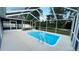 Sparkling pool with clear blue water, surrounded by a screened enclosure at 28818 Midnight Star Loop, Wesley Chapel, FL 33543