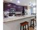 Gourmet kitchen features granite countertops, stainless steel appliances, and ample seating at the center island at 309 Dakota Hill Dr, Seffner, FL 33584