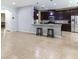 Open-concept living space with a modern kitchen featuring a center island and stainless steel appliances at 309 Dakota Hill Dr, Seffner, FL 33584