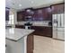 Modern kitchen featuring stainless steel appliances, granite countertops, and ample cabinet space for storage at 309 Dakota Hill Dr, Seffner, FL 33584