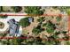Aerial view of home with long private driveway, pool, lush trees, and bordered by a red line at 3114 Little Rd, Valrico, FL 33596