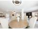Dining room with wood table, chandelier, and marble floors at 3114 Little Rd, Valrico, FL 33596