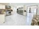 Spacious kitchen with stainless steel appliances and bright marble flooring at 3114 Little Rd, Valrico, FL 33596