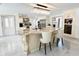 Spacious kitchen boasts a large island with stone countertop and modern appliances at 3114 Little Rd, Valrico, FL 33596