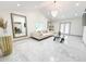 Bright living area featuring a neutral sofa, glass coffee table, and ample light at 3114 Little Rd, Valrico, FL 33596