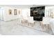 Spacious living room featuring marble flooring, fireplace, and modern decor at 3114 Little Rd, Valrico, FL 33596