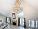 Bright living room with tall ceilings, a fireplace, and a large window at 3114 Little Rd, Valrico, FL 33596