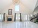 Bright and airy living room featuring a fireplace and staircase at 3114 Little Rd, Valrico, FL 33596