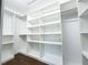 Spacious walk-in closet with custom shelving and ample storage, perfect for organizing your wardrobe at 3114 Little Rd, Valrico, FL 33596
