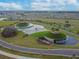 Aerial view of the neighborhood showcasing lakes, landscaping and attractive community design at 31637 Cannon Rush Dr, San Antonio, FL 33576