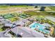 Overhead view of the community amenities including a pool, tennis courts, and clubhouse at 31637 Cannon Rush Dr, San Antonio, FL 33576