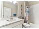 Bright bathroom with a modern vanity, fresh white cabinets, and shower at 31637 Cannon Rush Dr, San Antonio, FL 33576