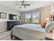 Relaxing bedroom featuring a ceiling fan, flat screen tv and ample natural light and decor at 31637 Cannon Rush Dr, San Antonio, FL 33576