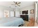 Bright bedroom with ceiling fan, flat screen tv, and an en suite bath for easy access and privacy at 31637 Cannon Rush Dr, San Antonio, FL 33576