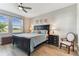 Comfortable bedroom with a ceiling fan, natural light, and stylish decor creating a relaxing atmosphere at 31637 Cannon Rush Dr, San Antonio, FL 33576