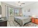 Cozy bedroom with neutral decor, plush bedding, and a ceiling fan at 31637 Cannon Rush Dr, San Antonio, FL 33576