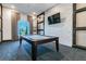 Billiard room featuring a stylish pool table, modern lighting, and a TV for added entertainment at 31637 Cannon Rush Dr, San Antonio, FL 33576