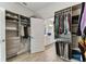 Custom closet organizers with hanging storage and shelving leading into the bathroom at 31637 Cannon Rush Dr, San Antonio, FL 33576