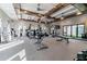 Well-equipped fitness center with modern equipment and large windows for natural light at 31637 Cannon Rush Dr, San Antonio, FL 33576