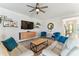 Inviting living room featuring a stylish media center, comfortable seating, and contemporary decor at 31637 Cannon Rush Dr, San Antonio, FL 33576