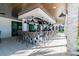Stylish outdoor bar area with ample seating and views of the landscaped surroundings at 31637 Cannon Rush Dr, San Antonio, FL 33576
