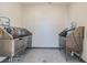 Pet washing station featuring dual stainless steel sinks and tiled walls at 31637 Cannon Rush Dr, San Antonio, FL 33576