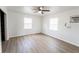 Spacious bedroom featuring wood floors, ceiling fan and natural light at 3253 57Th N Ave, St Petersburg, FL 33714