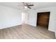 Large bedroom with wood floors, fan and closet at 3253 57Th N Ave, St Petersburg, FL 33714