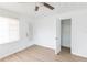 Bright bedroom boasts new floors, a ceiling fan, a window, and closet access at 3253 57Th N Ave, St Petersburg, FL 33714