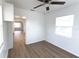 Bright bedroom with ceiling fan, white walls, hard wood floors, and natural light at 3253 57Th N Ave, St Petersburg, FL 33714