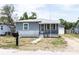 Exterior view of a well-kept home with a neat yard and charming curb appeal at 3253 57Th N Ave, St Petersburg, FL 33714